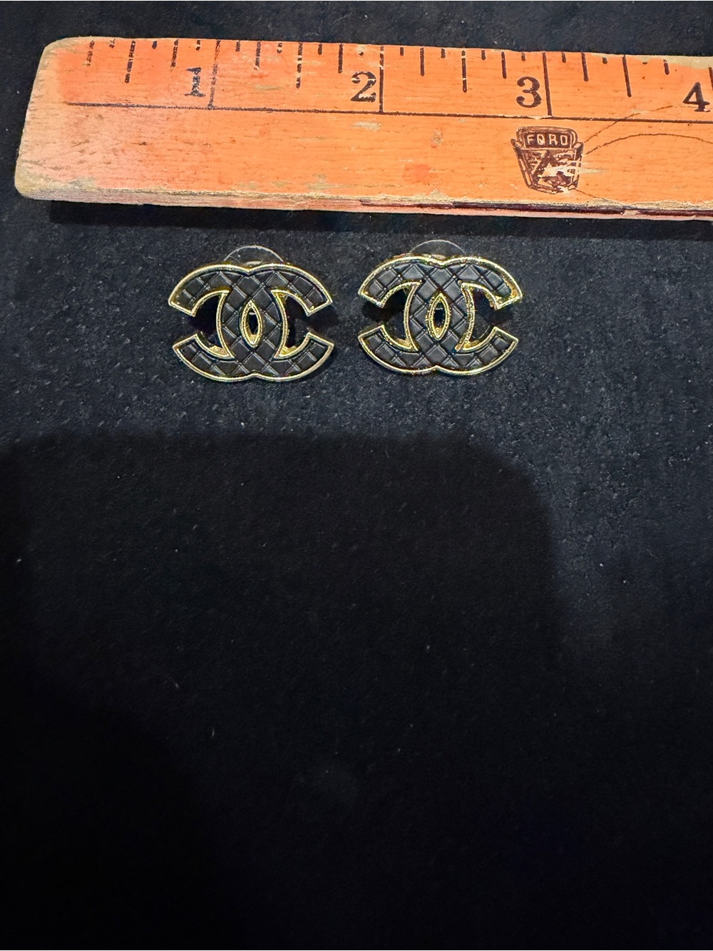 Chanel quilted pattern black and Gold Interlocking CC Stud Earrings